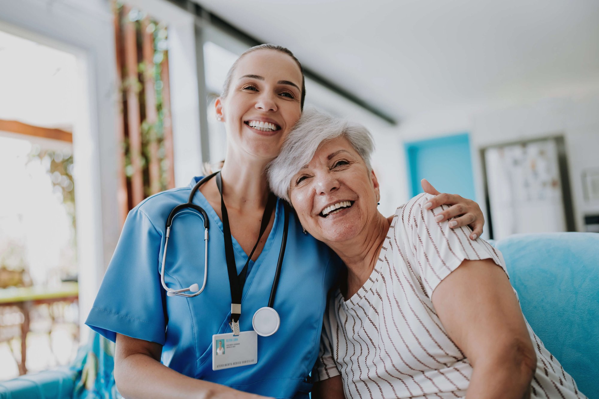 Aged care worker hugging