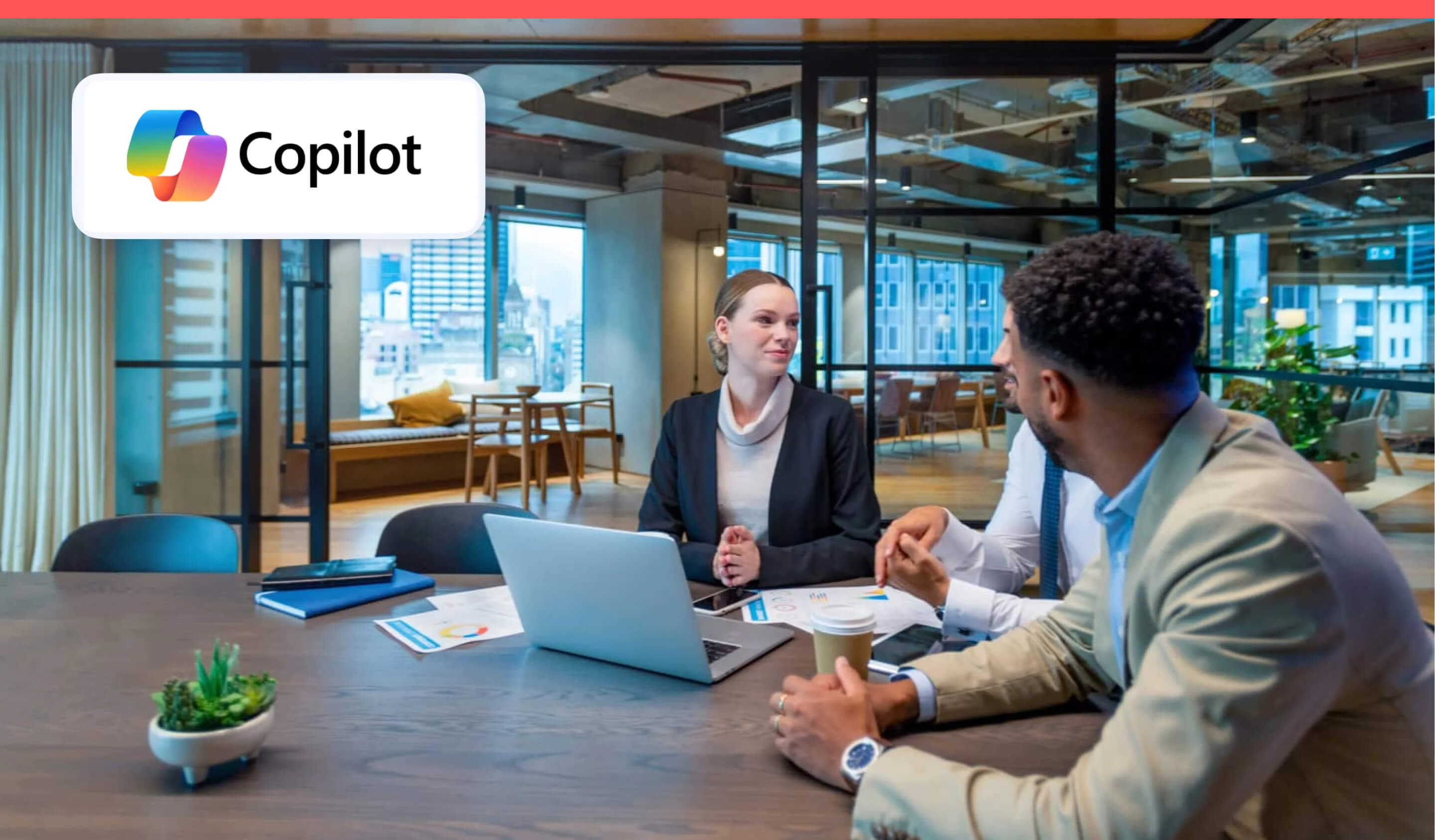 Group of workers at an office table with Copilot